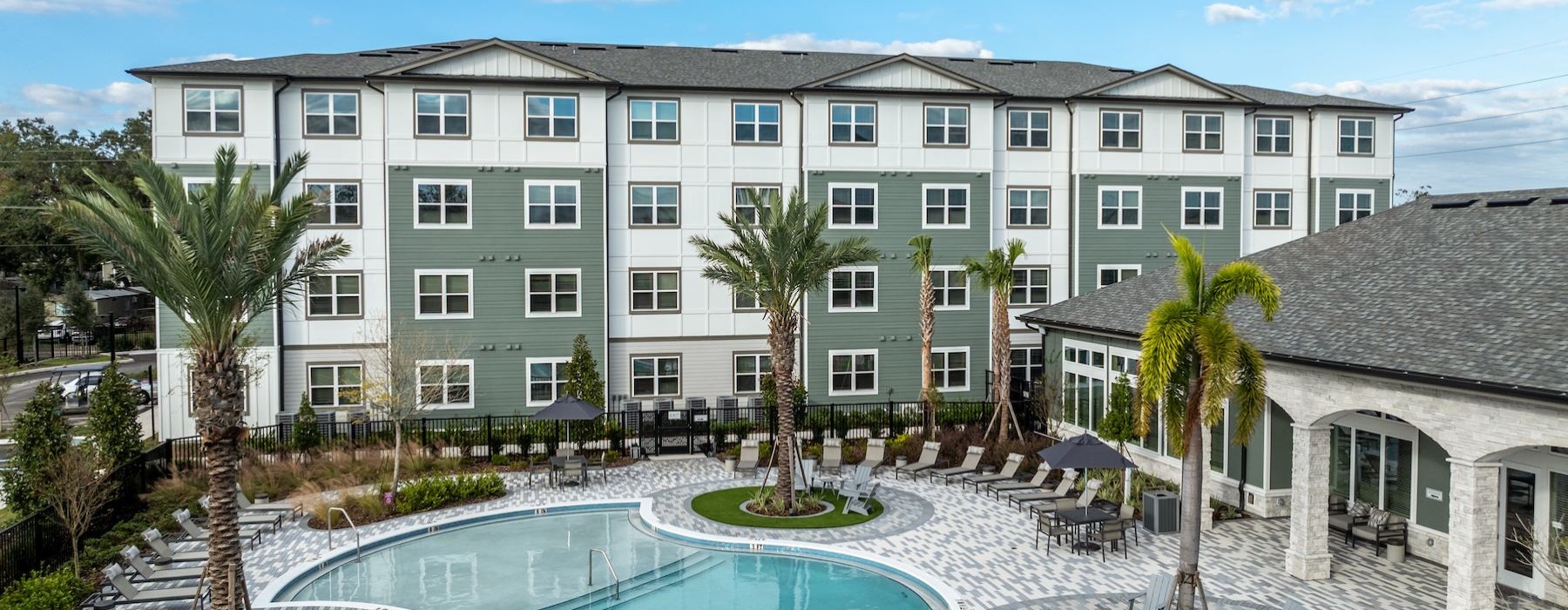 an apartment building with a swimming pool