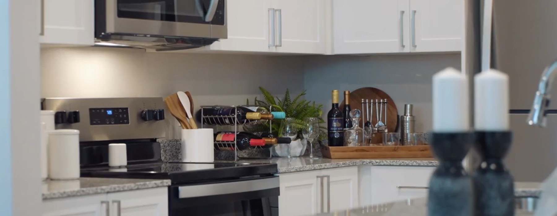 a kitchen with white cabinets