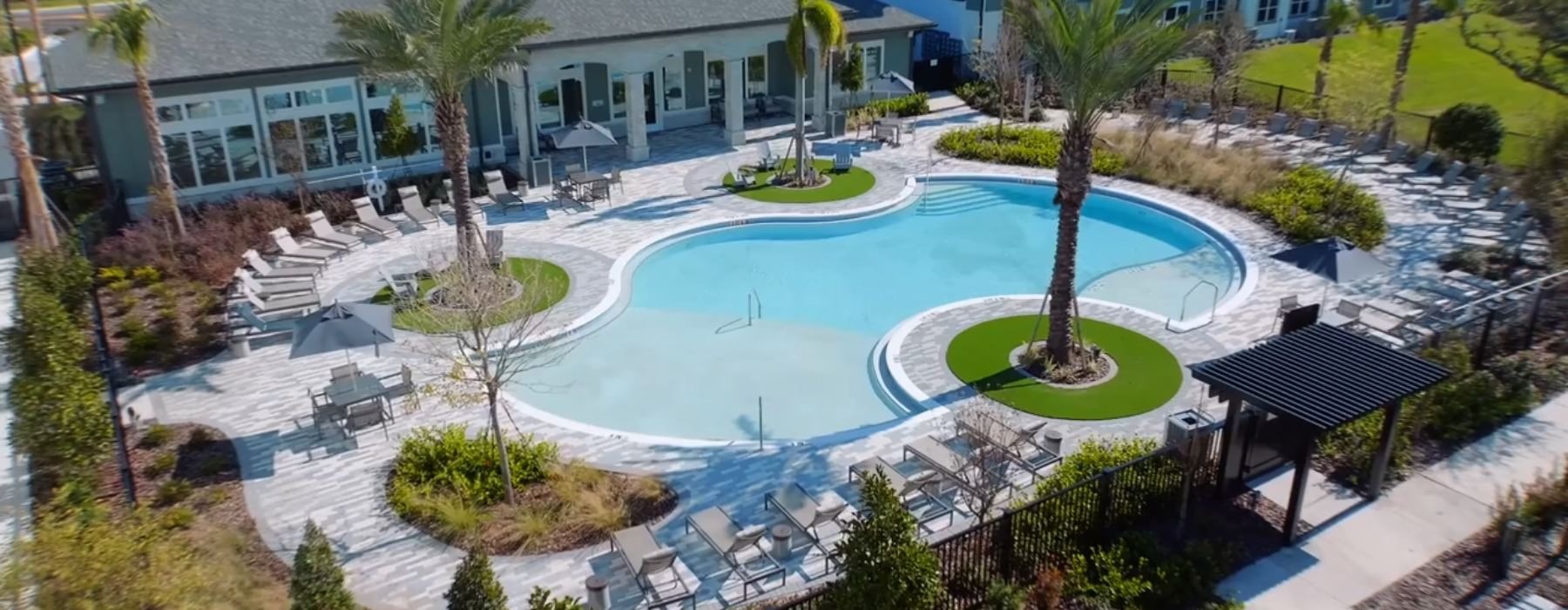 an aerial view of a courtyard with a pool